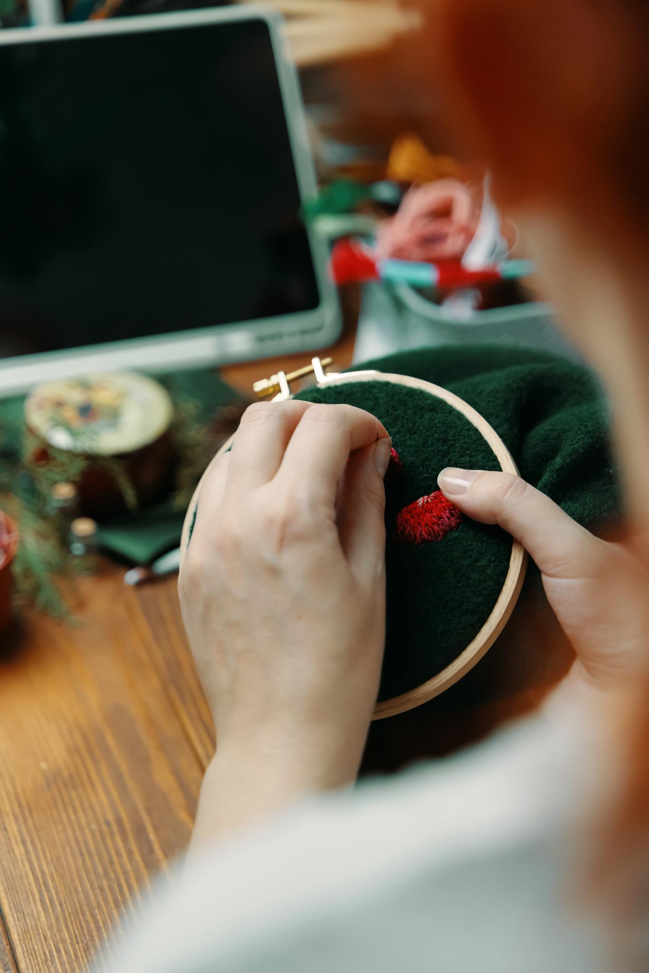 Instructor demonstrating hand embroidery stitches